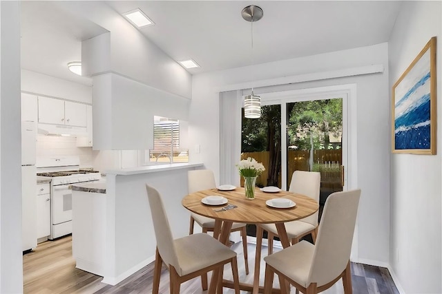9406 Quail Meadow Dr, Austin, TX 78758 - dining area featuring light wood-type flooring and baseboards