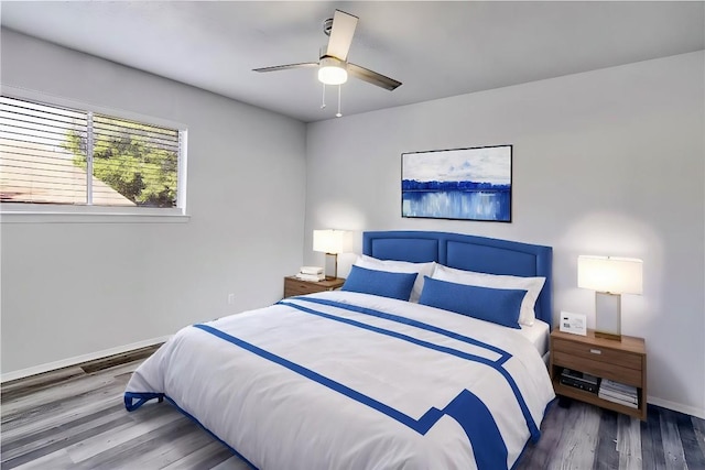 9406 Quail Meadow Dr, Austin, TX 78758 - bedroom featuring wood finished floors, baseboards, and a ceiling fan