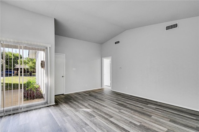 9406 Quail Meadow Dr, Austin, TX 78758 - unfurnished room featuring vaulted ceiling, wood finished floors, and baseboards