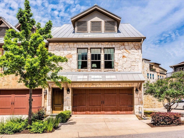 332 Adams St, Georgetown, TX 78628 - view of front of house with a standing seam roof, stone siding, and metal roof