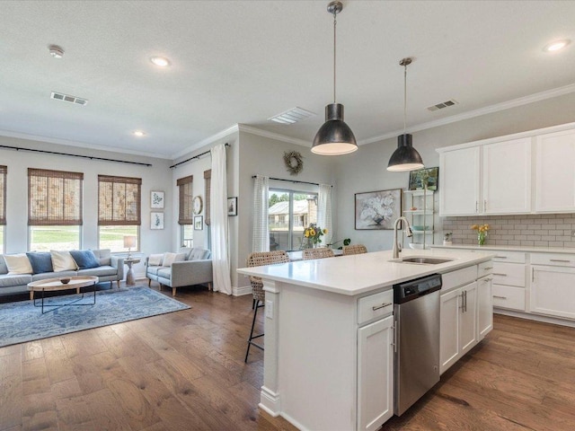 332 Adams St, Georgetown, TX 78628 - kitchen with dishwasher, a sink, crown molding, open floor plan, and backsplash