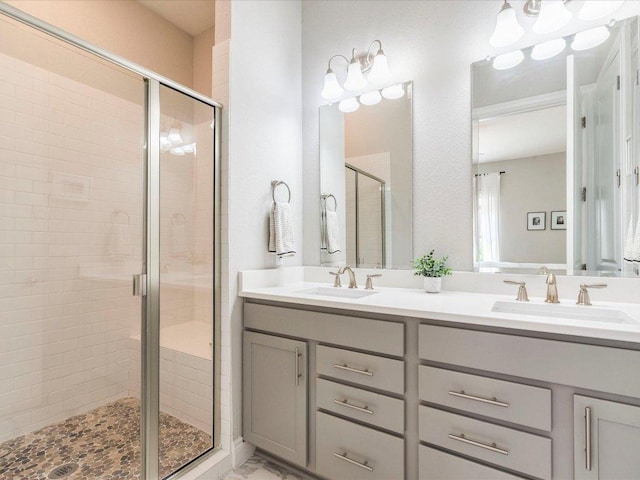 332 Adams St, Georgetown, TX 78628 - bathroom featuring a stall shower and double vanity
