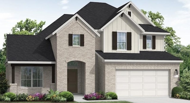 221 Five Mile Creek Way, Kyle, TX 78640 - view of front facade featuring concrete driveway, board and batten siding, a garage, and brick siding