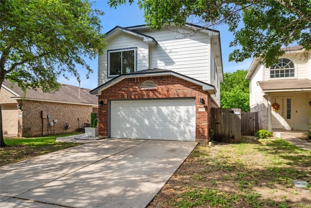 11710 Raymond C Ewry Ln, Austin, TX 78748 - traditional-style house with brick siding, a garage, and driveway