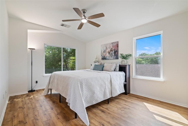 11710 Raymond C Ewry Ln, Austin, TX 78748 - bedroom featuring wood finished floors, lofted ceiling, baseboards, and a ceiling fan