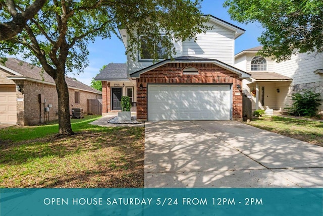 11710 Raymond C Ewry Ln, Austin, TX 78748 - traditional home featuring brick siding, an attached garage, driveway, central air condition unit, and a front yard