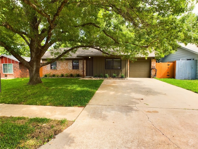 6007 Leisure Run Rd, Austin, TX 78745 - view of front of house featuring concrete driveway, board and batten siding, an attached garage, and brick siding