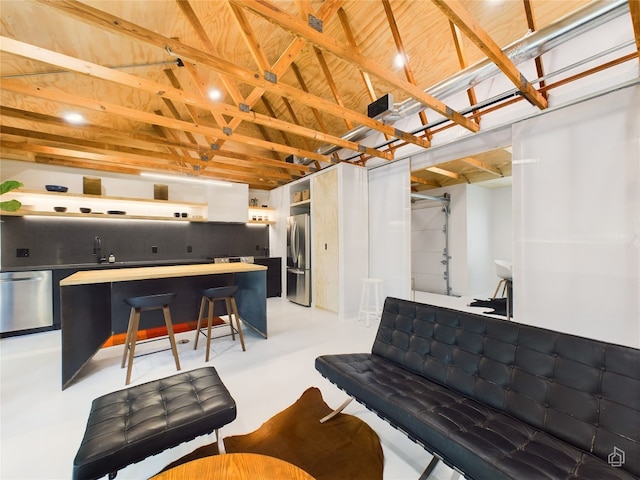 6007 Leisure Run Rd, Austin, TX 78745 - living area featuring lofted ceiling and finished concrete flooring
