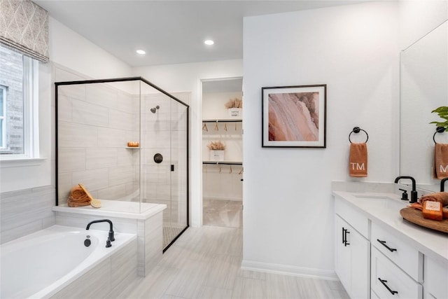 1403 Plum Tree Way, Georgetown, TX 78628 - full bathroom with a stall shower, vanity, a garden tub, healthy amount of natural light, and recessed lighting