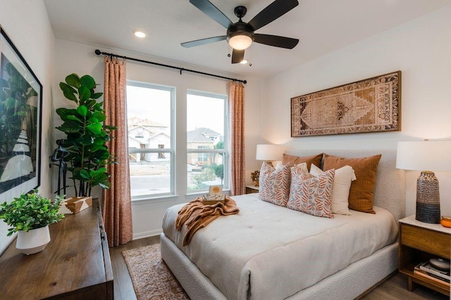 1403 Plum Tree Way, Georgetown, TX 78628 - bedroom featuring multiple windows, wood finished floors, recessed lighting, and baseboards