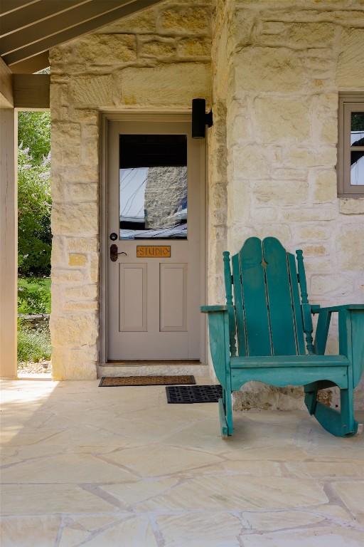 3020 Maravillas Loop, Austin, TX 78735 - doorway to property featuring stone siding
