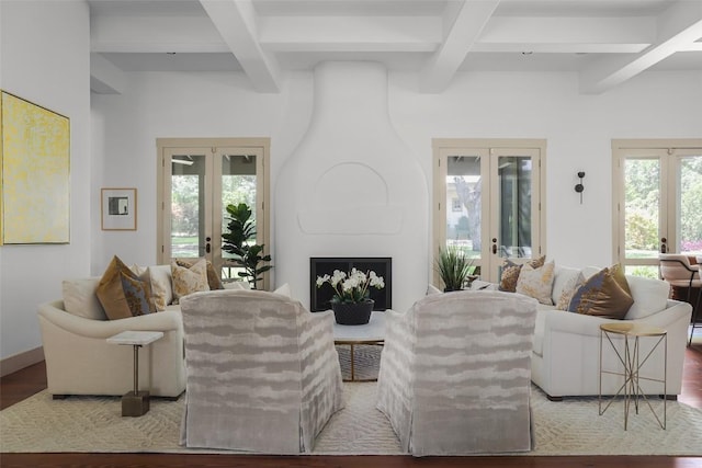 3020 Maravillas Loop, Austin, TX 78735 - living area featuring french doors, beamed ceiling, coffered ceiling, wood finished floors, and a fireplace