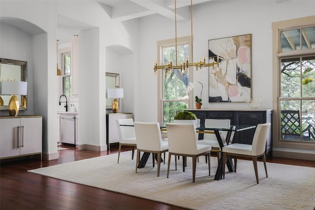 3020 Maravillas Loop, Austin, TX 78735 - dining area featuring arched walkways and wood finished floors