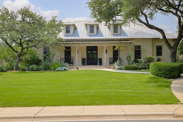3020 Maravillas Loop, Austin, TX 78735 - view of front of property featuring french doors, a front lawn, a porch, a standing seam roof, and a metal roof