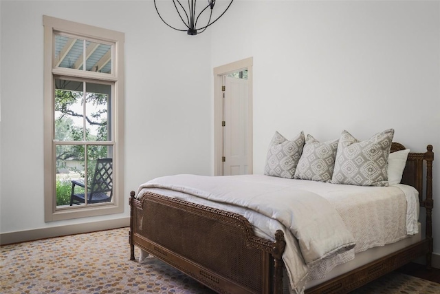 3020 Maravillas Loop, Austin, TX 78735 - bedroom featuring a chandelier and a towering ceiling