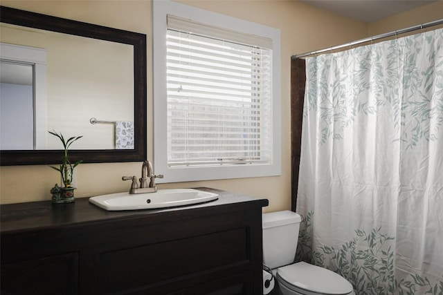 2400 Pruett St, Austin, TX 78703 - full bathroom with vanity, toilet, and a shower with shower curtain