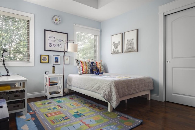 2400 Pruett St, Austin, TX 78703 - bedroom featuring wood finished floors, multiple windows, and baseboards