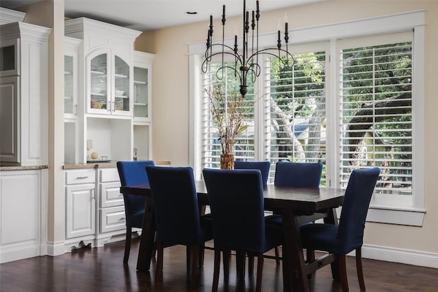 2400 Pruett St, Austin, TX 78703 - dining space with dark wood-style flooring, baseboards, and a chandelier