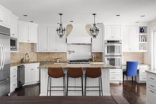 2400 Pruett St, Austin, TX 78703 - kitchen with custom exhaust hood, built in appliances, a sink, a kitchen island, and white cabinets