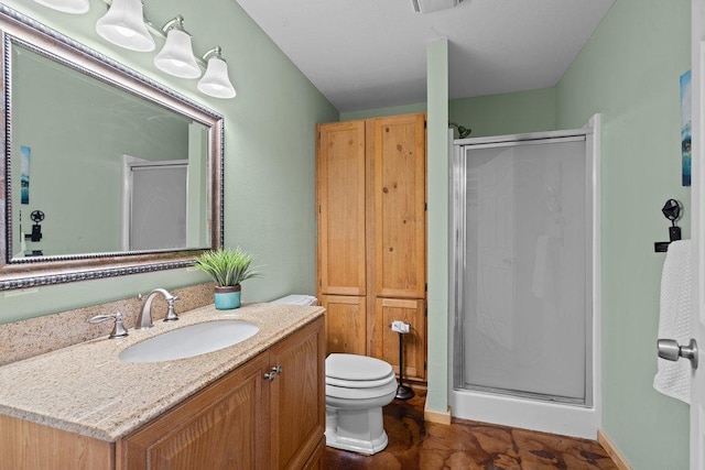 204 Bridges Ln, Buda, TX 78610 - full bathroom featuring a shower stall, vanity, and toilet