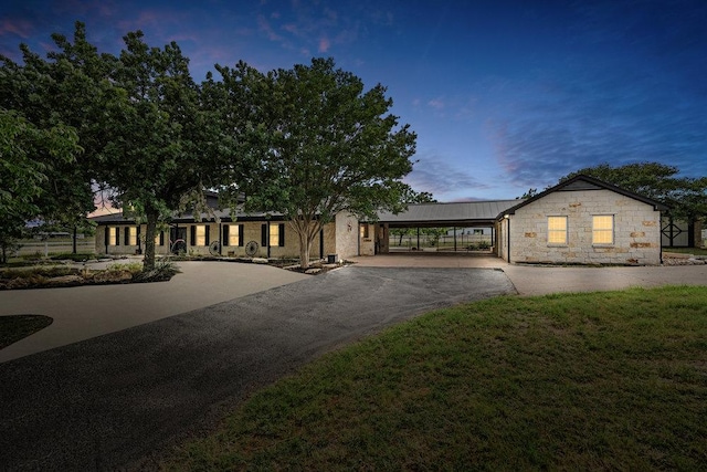 204 Bridges Ln, Buda, TX 78610 - ranch-style home with driveway, stone siding, and a yard