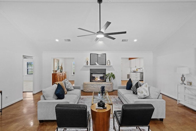 204 Bridges Ln, Buda, TX 78610 - living area featuring concrete flooring, a ceiling fan, a glass covered fireplace, recessed lighting, and baseboards