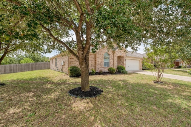 18725 Dry Lake Ln, Pflugerville, TX 78660 - view of property hidden behind natural elements with concrete driveway, brick siding, and an attached garage