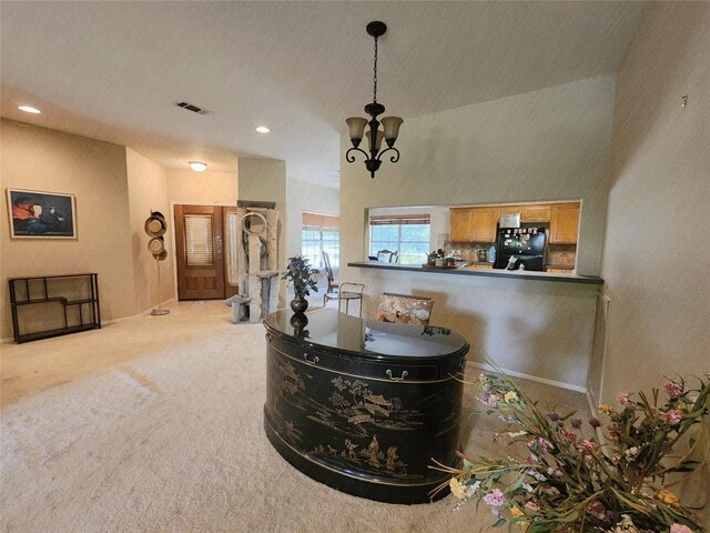 1726 Riverchase Ave, Smithville, TX 78957 - detailed view of freestanding refrigerator, carpet, a chandelier, and recessed lighting
