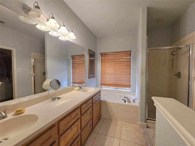 1726 Riverchase Ave, Smithville, TX 78957 - bathroom with a shower stall, a bath, tile patterned floors, and double vanity