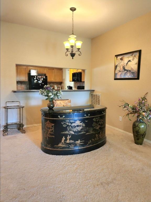 1726 Riverchase Ave, Smithville, TX 78957 - detailed view of carpet floors, black appliances, baseboards, and a chandelier