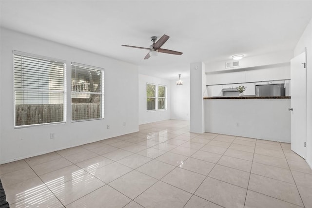4413 Whispering Valley Dr, Austin, TX 78727 - unfurnished living room featuring light tile patterned floors and a ceiling fan