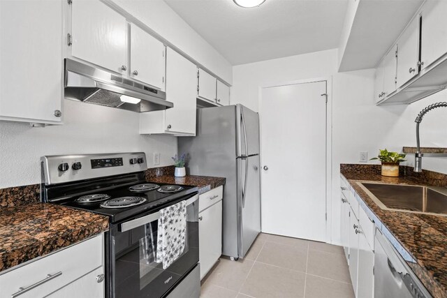 4413 Whispering Valley Dr, Austin, TX 78727 - kitchen with appliances with stainless steel finishes, under cabinet range hood, a sink, and white cabinets
