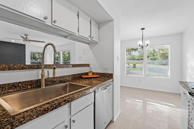 4413 Whispering Valley Dr, Austin, TX 78727 - kitchen with a sink, dishwasher, dark countertops, light tile patterned flooring, and white cabinets