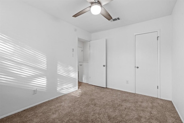 4413 Whispering Valley Dr, Austin, TX 78727 - unfurnished bedroom featuring carpet flooring, a ceiling fan, and baseboards