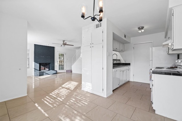 4413 Whispering Valley Dr, Austin, TX 78727 - kitchen with white appliances, a ceiling fan, open floor plan, under cabinet range hood, and white cabinetry
