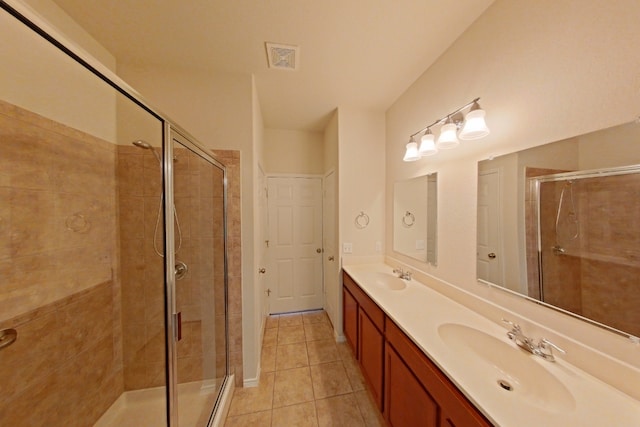 10116 Aly May Dr, Austin, TX 78748 - full bath featuring double vanity, a stall shower, and tile patterned floors