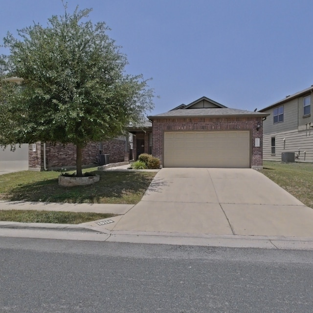 10116 Aly May Dr, Austin, TX 78748 - single story home with brick siding, an attached garage, concrete driveway, and central air condition unit
