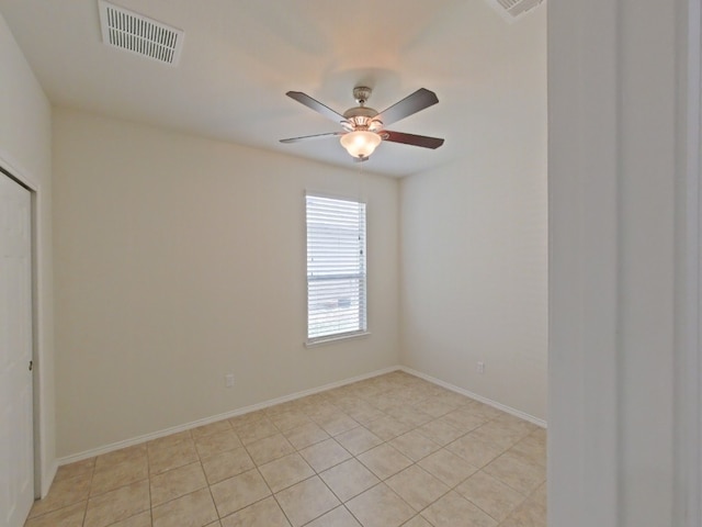 10116 Aly May Dr, Austin, TX 78748 - unfurnished room with a ceiling fan, light tile patterned floors, and baseboards