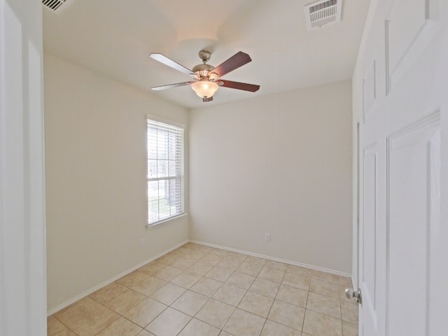 10116 Aly May Dr, Austin, TX 78748 - empty room featuring a ceiling fan, light tile patterned flooring, and baseboards