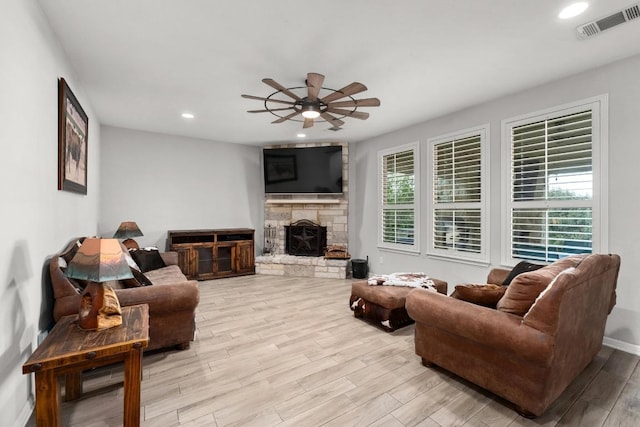 5109 Scenic Lake Dr, Georgetown, TX 78626 - living room featuring ceiling fan, light wood-style flooring, recessed lighting, a fireplace, and baseboards