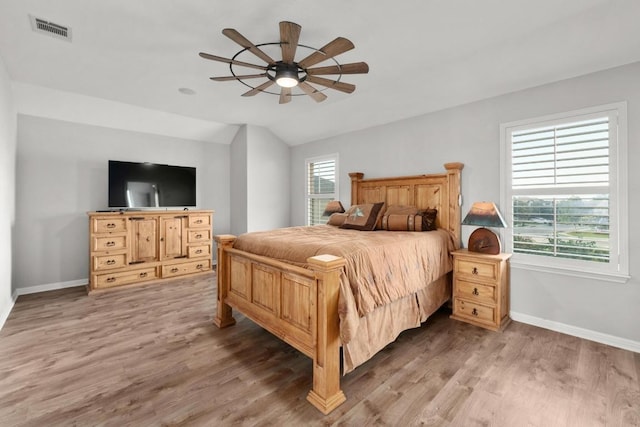5109 Scenic Lake Dr, Georgetown, TX 78626 - bedroom with lofted ceiling, baseboards, light wood-style floors, and ceiling fan