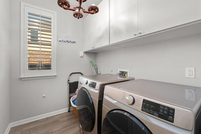 5109 Scenic Lake Dr, Georgetown, TX 78626 - laundry room with cabinet space, light wood-style floors, independent washer and dryer, baseboards, and a chandelier