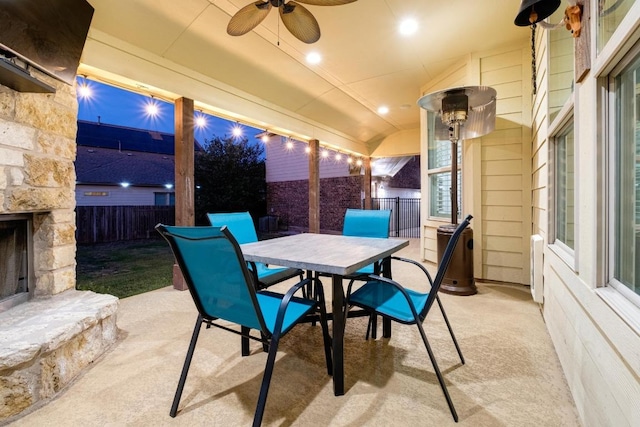 5109 Scenic Lake Dr, Georgetown, TX 78626 - view of patio / terrace featuring an outdoor stone fireplace, outdoor dining area, and ceiling fan