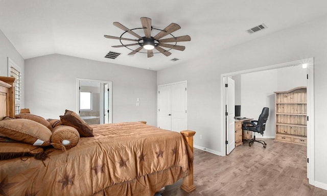 5109 Scenic Lake Dr, Georgetown, TX 78626 - bedroom with an office area, light wood-style flooring, vaulted ceiling, baseboards, and connected bathroom