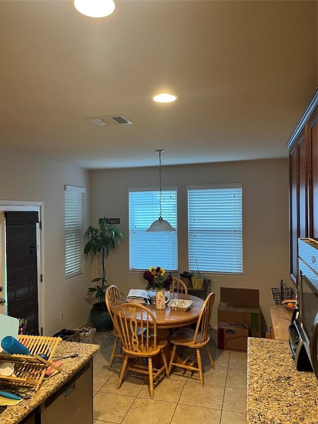dining room featuring light tile patterned floors and recessed lighting