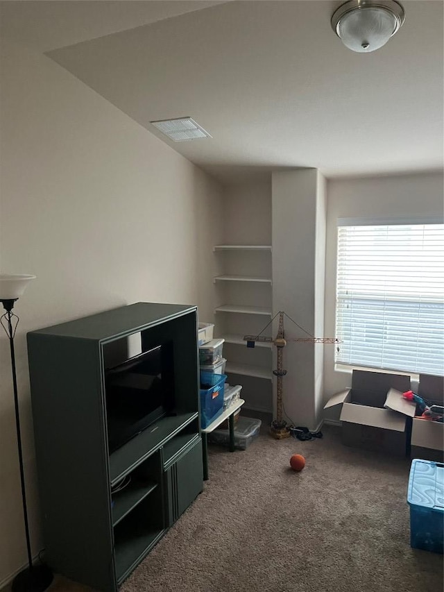 living area with carpet flooring