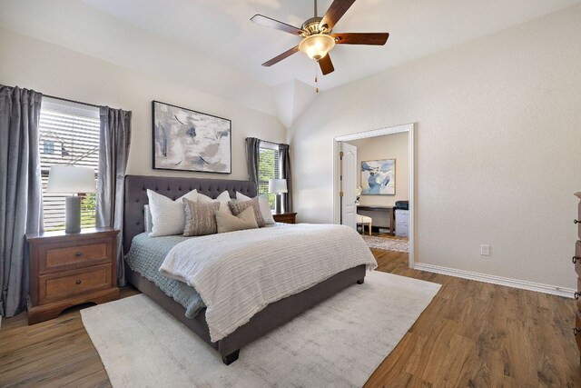 3633 Mineral Dr, Leander, TX 78641 - bedroom with wood finished floors, vaulted ceiling, baseboards, and a ceiling fan
