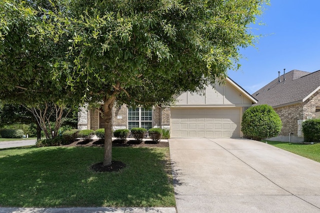 3633 Mineral Dr, Leander, TX 78641 - view of property hidden behind natural elements with a garage, driveway, a front lawn, and brick siding