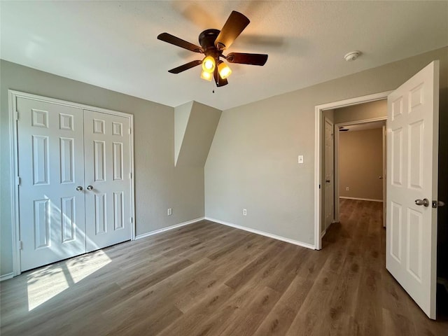 2009 Meadow View Dr, San Marcos, TX 78666 - unfurnished bedroom featuring wood finished floors, baseboards, a closet, and ceiling fan