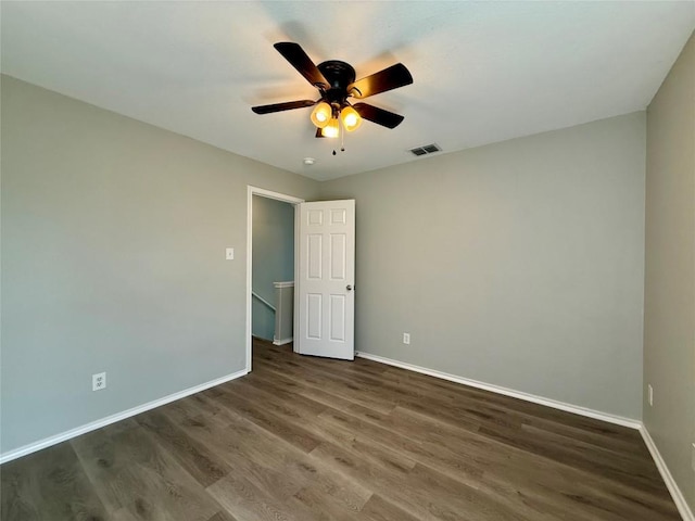 2009 Meadow View Dr, San Marcos, TX 78666 - unfurnished room featuring baseboards, wood finished floors, and a ceiling fan